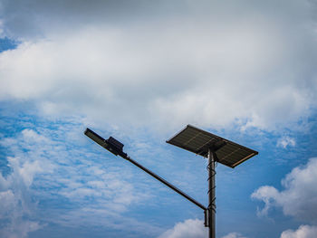 Low angle view of street light against sky