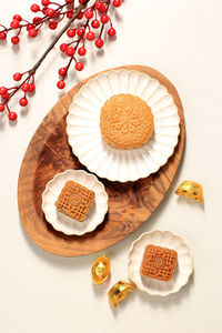 Top view mooncake on light background with tea. concept moon cake on mid autumn festival or