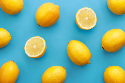 Close-up of lemons on blue background