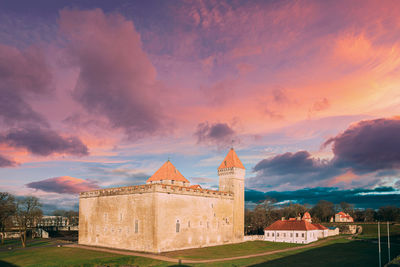 Historic building against sky during sunset