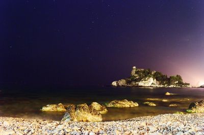 Scenic view of sea against sky at night