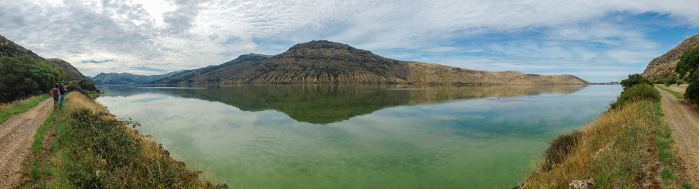 Panoramic view of lake and mountains against sky