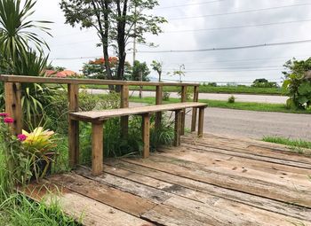 Chair and table against trees