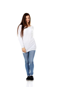 Portrait of smiling woman standing against white background