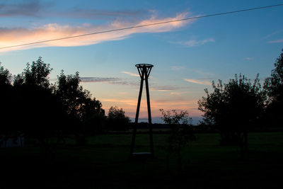 Scenic view of field against cloudy sky