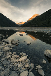 Scenic view of lake against sky during sunset