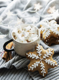 Christmas decorations, cocoa and gingerbread cookies. white wooden background.