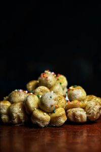 Close-up of cupcakes on table against black background