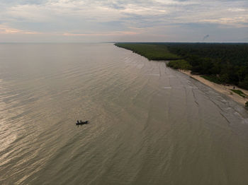 High angle view of sea against sky during sunset