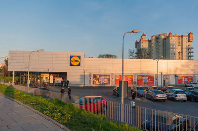 City street against sky during sunset