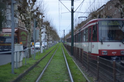 Train on railroad tracks against sky