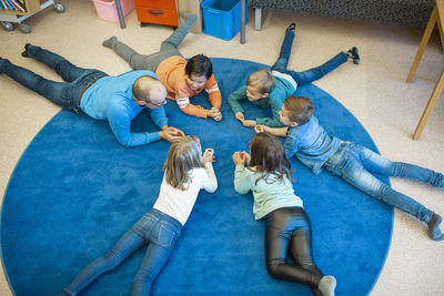 Teacher on floor with children