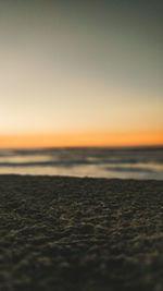 Scenic view of sea against clear sky during sunset