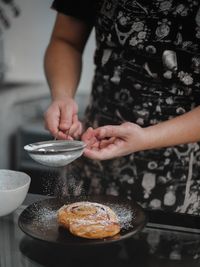 Midsection of woman preparing food