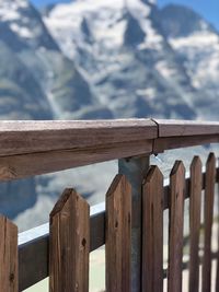 Close-up of fence against mountains