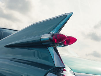 Close-up of red car against sky