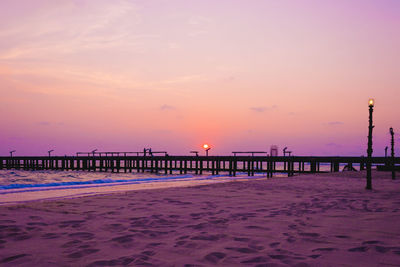 Scenic view of beach against sky during sunset