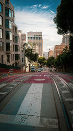 City street and buildings against sky