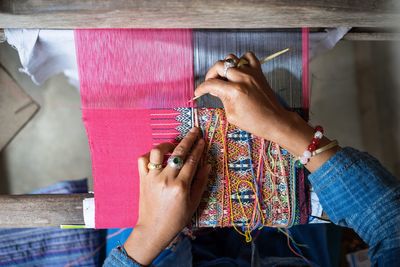 Cropped image of hand weaving on handloom