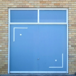 Close-up of blue wall with windows