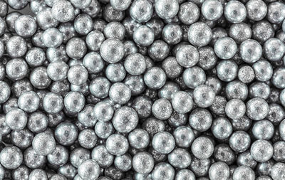 Sprinkles silver ball confections seamless background, top view, macro
