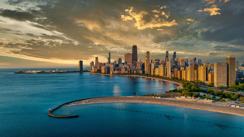 Scenic view of chicago against sky during sunset 