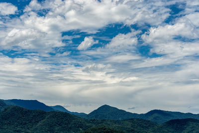 View of mountain range against cloudy sky