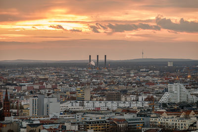Cityscape against sky during sunset
