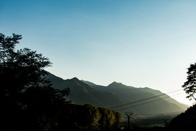 Scenic view of silhouette mountains against clear sky