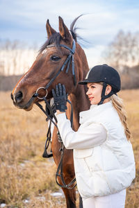 Rear view of horse standing on field