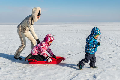 Full length of girl on snow covered land