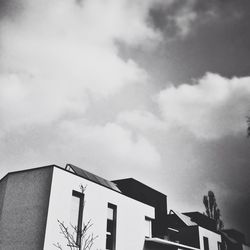 High section of building against cloudy sky