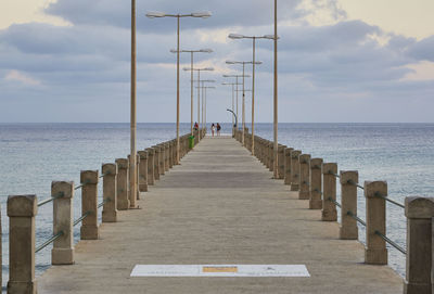 View of pier over sea against sky