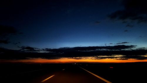 Road against sky at night