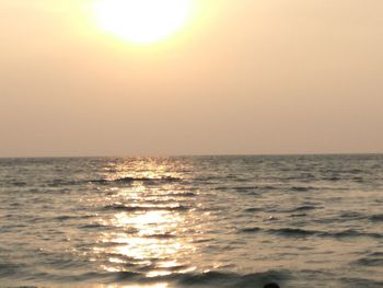 Scenic view of sea against sky at sunset