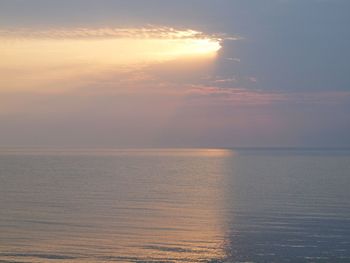 Scenic view of sea against sky at sunset