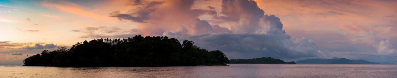 Panoramic view of sea against sky during sunset