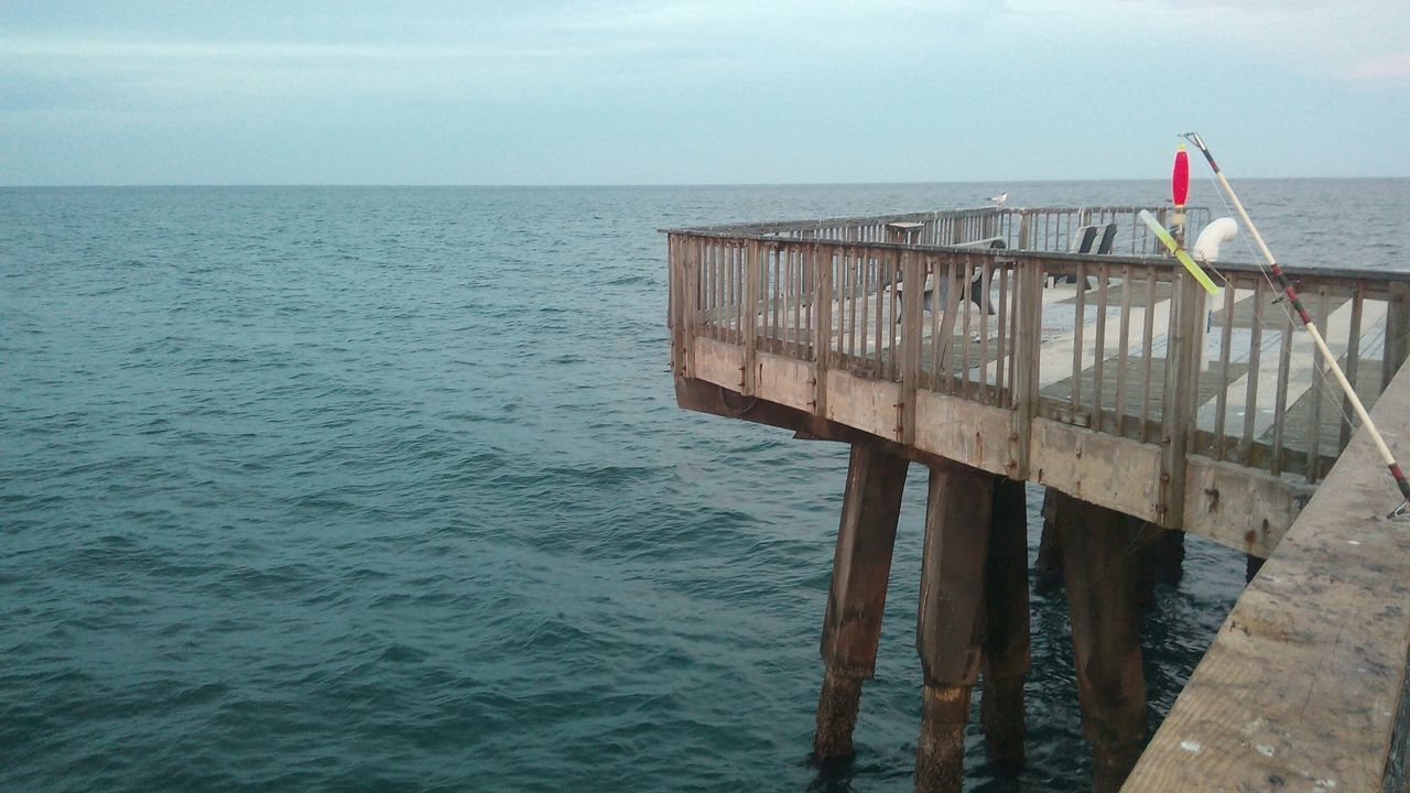 water, sea, horizon over water, tranquility, tranquil scene, sky, pier, nature, wood - material, scenics, beauty in nature, nautical vessel, beach, rippled, day, railing, boat, no people, calm, jetty