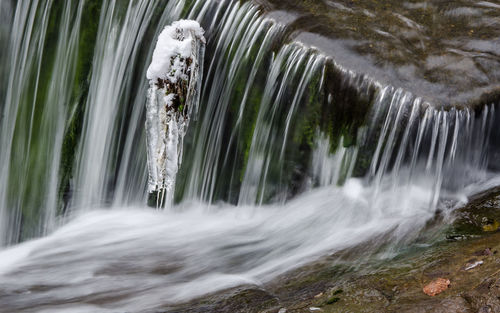 Close-up of waterfall against blurred background