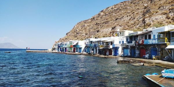 Panoramic view of sea against buildings