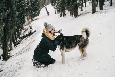 Dog on snow covered land