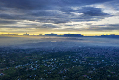 Scenic view of landscape against dramatic sky