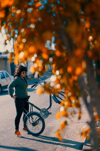 Portrait of woman riding a bicycle in the street
