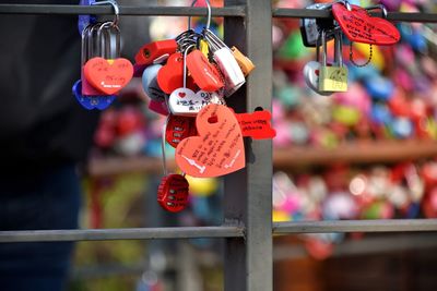 Close-up of love padlocks hanging on metal