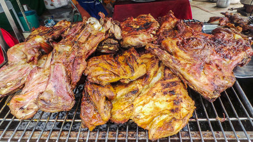 High angle view of meat on barbecue grill