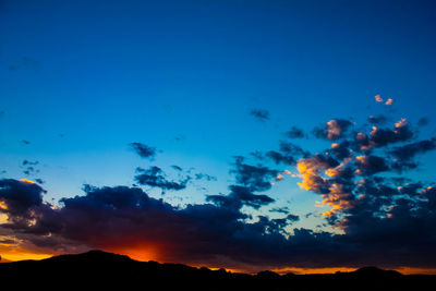 Low angle view of dramatic sky during sunset