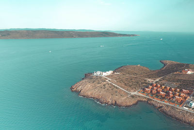 High angle view of bay on shore against sky