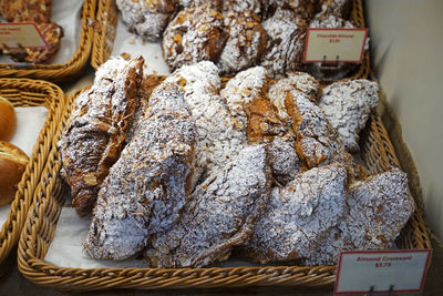 Close up display shelf of almond croissants