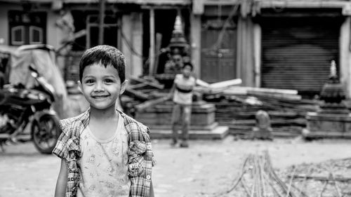 Portrait of boy standing outdoors
