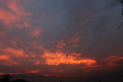 Low angle view of dramatic sky during sunset